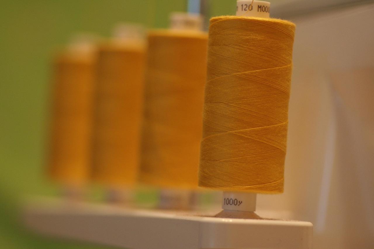 thread, spool, sewing, overlocker, cotton, polyester, yarn, machine, sew, clothing, textile, stitch, craft, needlework, handicraft, dressmaking, serger, yellow, colour, brown clothes, polyester, polyester, polyester, polyester, polyester